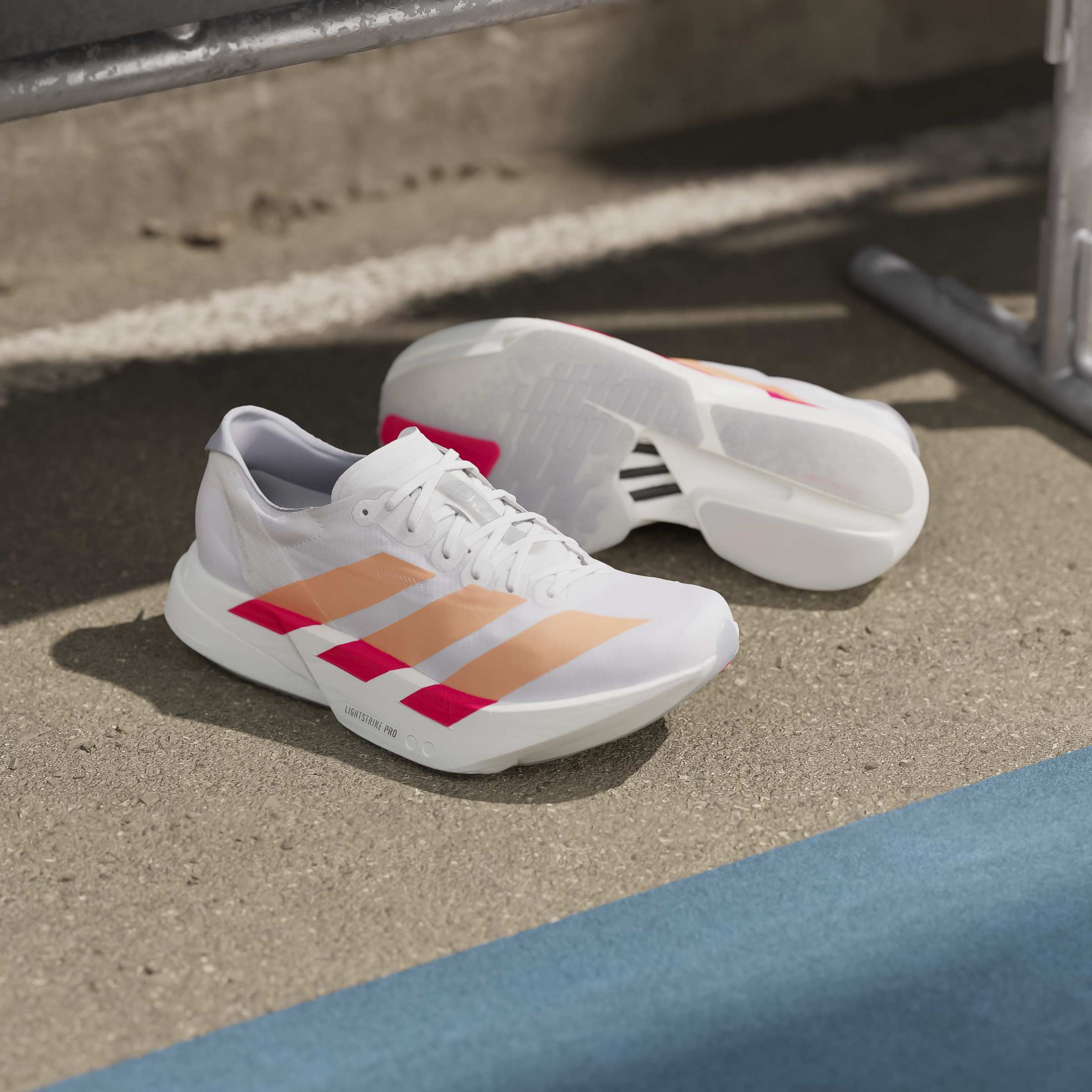 adidas Adizero Adios Pro 4 | Cloud White / Beam Orange / Lucid Red | Womens - Ekiden Sports